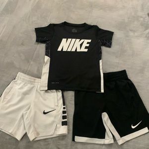 Black and white Nike dri fit shirt with two pairs of matching shorts.